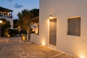 A building with a white exterior, a door, and a window. - Mykonos Sunday Home Costa Ilios (Mykonos)