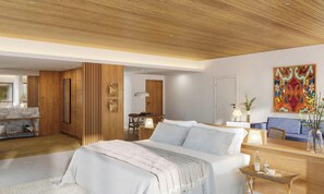 A modern hotel room with a large bed, a desk, a sofa, and a dining area.