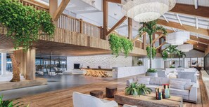 Un vestíbul ampli amb bigues de fusta, una taquilla d'informació, zones d'estar i plantes d'interior.