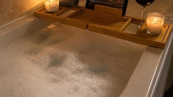 Combined shower/bathtub, deep-soaking bathtub, hair dryer, towels