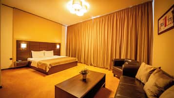 Minibar, desk, blackout curtains, iron/ironing board