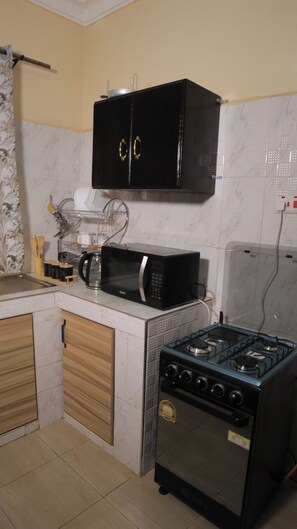 Private kitchen - Atié Haven, a Cozy Afro-Modern 2-bedroom bed & breakfast in the Heart of Lira (Lira)