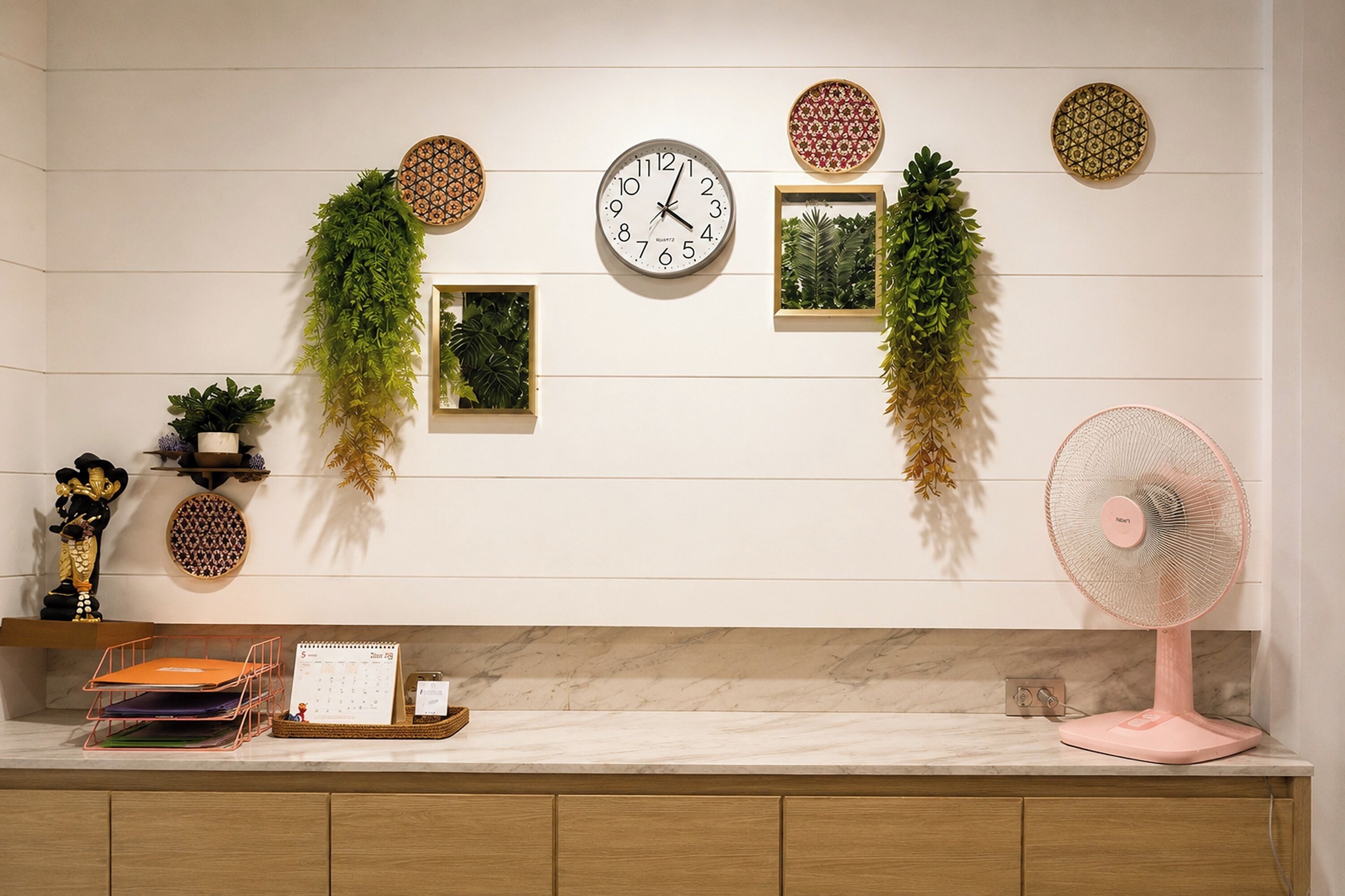 A kitchen with a whiteboard, calendar, and decorative wall hangings.