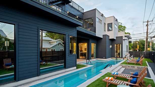 A modern house with a swimming pool, outdoor seating, and a balcony. - Skyline in Hyde ~Two Rooftop Terraces~ Pool+Spa (Austin)