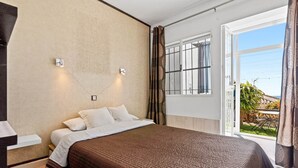 A bedroom with a bed, a window with curtains, and a view of the outdoors. - 2 Bed Panoramic Sea Views RDR543 (Benalmádena)