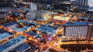 A cityscape with a prominent hotel named LUMINA HOTEL. - 9820 Healthpark Cir #101 (Fort Myers)