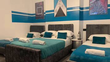 Apartment, 3 Bedrooms, Ground Floor | Desk, laptop workspace, blackout curtains, iron/ironing board