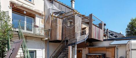 A multi-story building with a staircase leading to the upper floors.