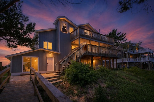 LegaSea: Experience coastal living, a spacious 5-bed, 4-bath home in Oak Island.