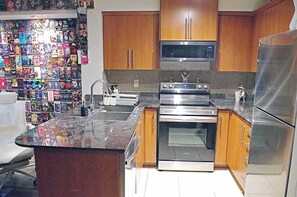 Private kitchen - World's Only Live-In Video Store · 1200+ VHS tapes (Toronto)