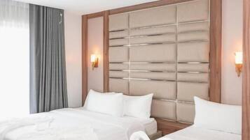 Superior Triple Room, City View | In-room safe, desk, laptop workspace, soundproofing