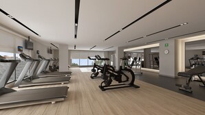 A modern gym with treadmills, weight machines, and a bench. - Courtyard by Marriott Torreon (Torreon)