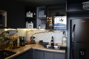 Microwave, coffee/tea maker, cookware/dishes/utensils