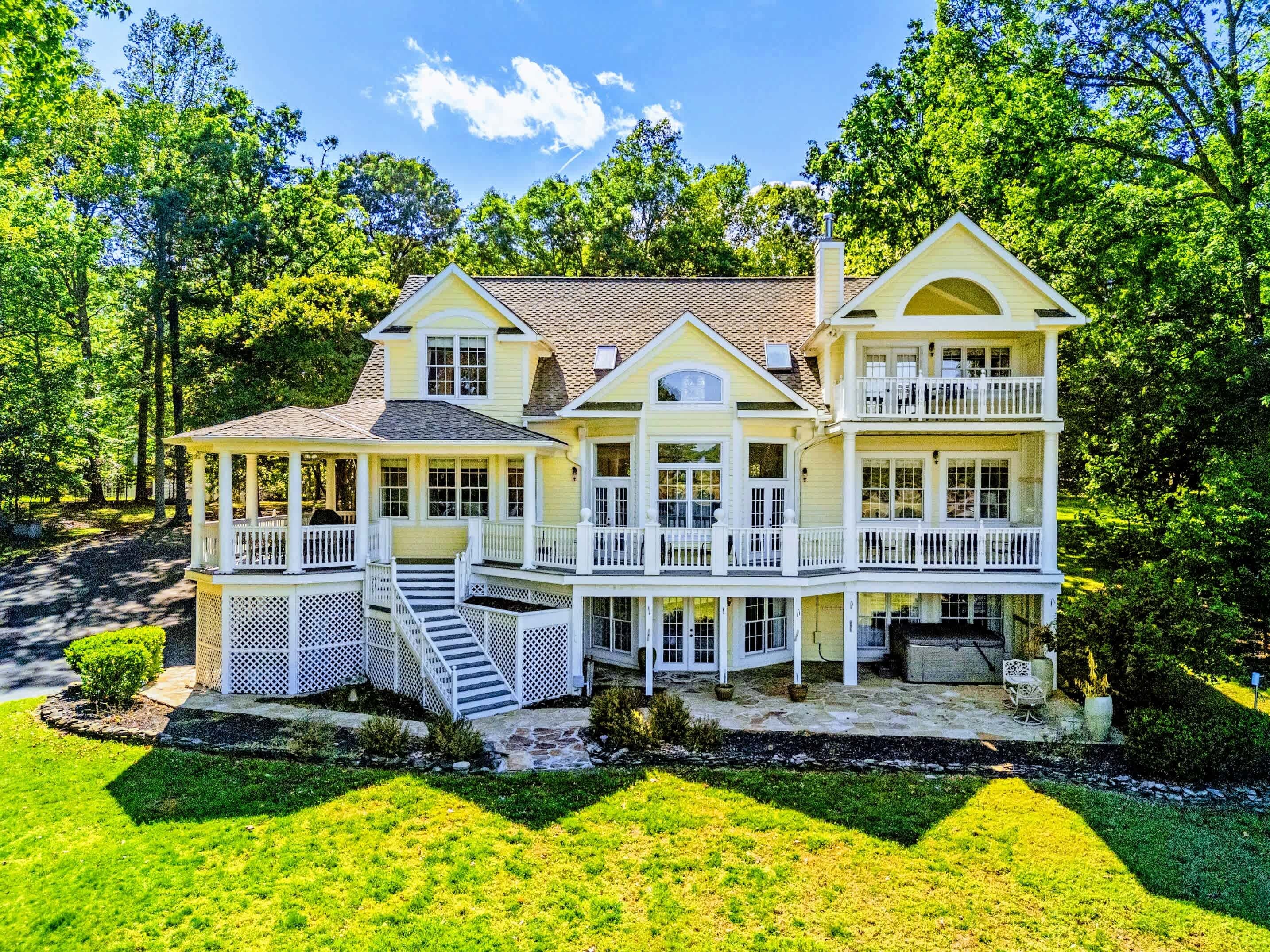 From Above - Multi-tiered decks and balconies wrap the back of the home.