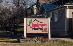 A sign for 'Lanman's Market' with a house illustration and a fruit basket. - The Hinesburg Hideaway Unit 3 (Hinesburg)