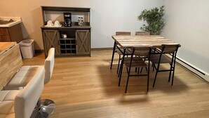 A room with a dining table, chairs, a coffee station, and a potted plant. - Cozy 2-bedroom in quaint Sturgis.  1 Mile to Main Street (Sturgis)