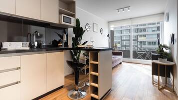 Apartment | Private kitchen | Full-size fridge, microwave, oven, stovetop