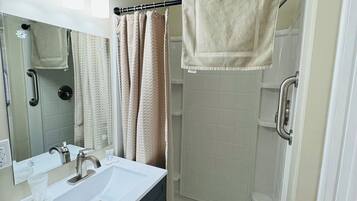 Shower, hair dryer, towels
