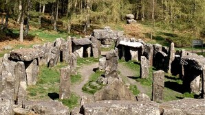 Ancient stone structures with a clear path leading through them, surrounded by trees. - The Loft On The Yorkshire Dales (Ripon)