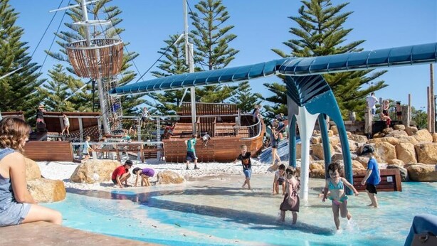 A water park with a ship-themed play area, a pool, and surrounding trees. - Apiwa Busselton Seaside Escape Apartments (Busselton)