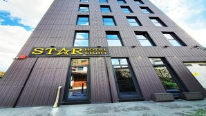 A tall hotel building with a modern facade, large windows, and a prominent 'STAR HOTEL LIGHT' sign. - Hotel Star Light Tirane (Tirana)