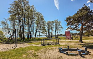 A park with swings, a climbing structure, and picnic tables. - Beautiful home in Tolvsrød (Tolvsrød)