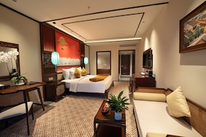 A hotel room with a bed, a sofa, a desk, a TV, and a large window. - HOI AN MOON PREMIUM BOUTIQUE HOTEL & SPA (Hoi An Đong)