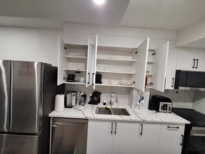 Coffee/tea maker, fridge, microwave, oven
