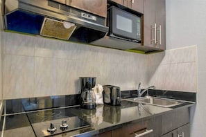 Fridge, microwave, stovetop, coffee/tea maker