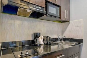 Fridge, microwave, stovetop, coffee/tea maker