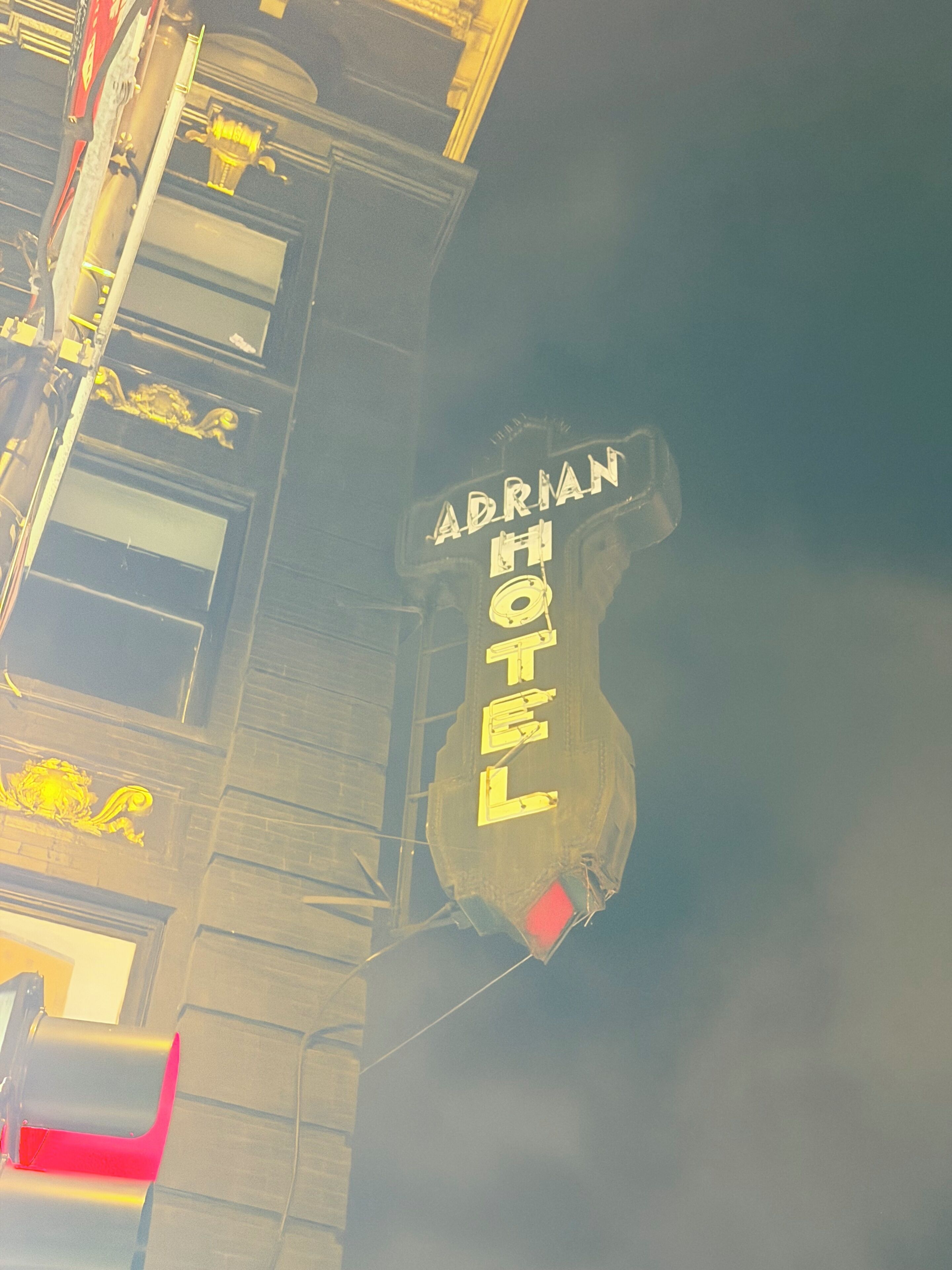 A building with a sign that reads 'ABRIMAN HOTEL.'