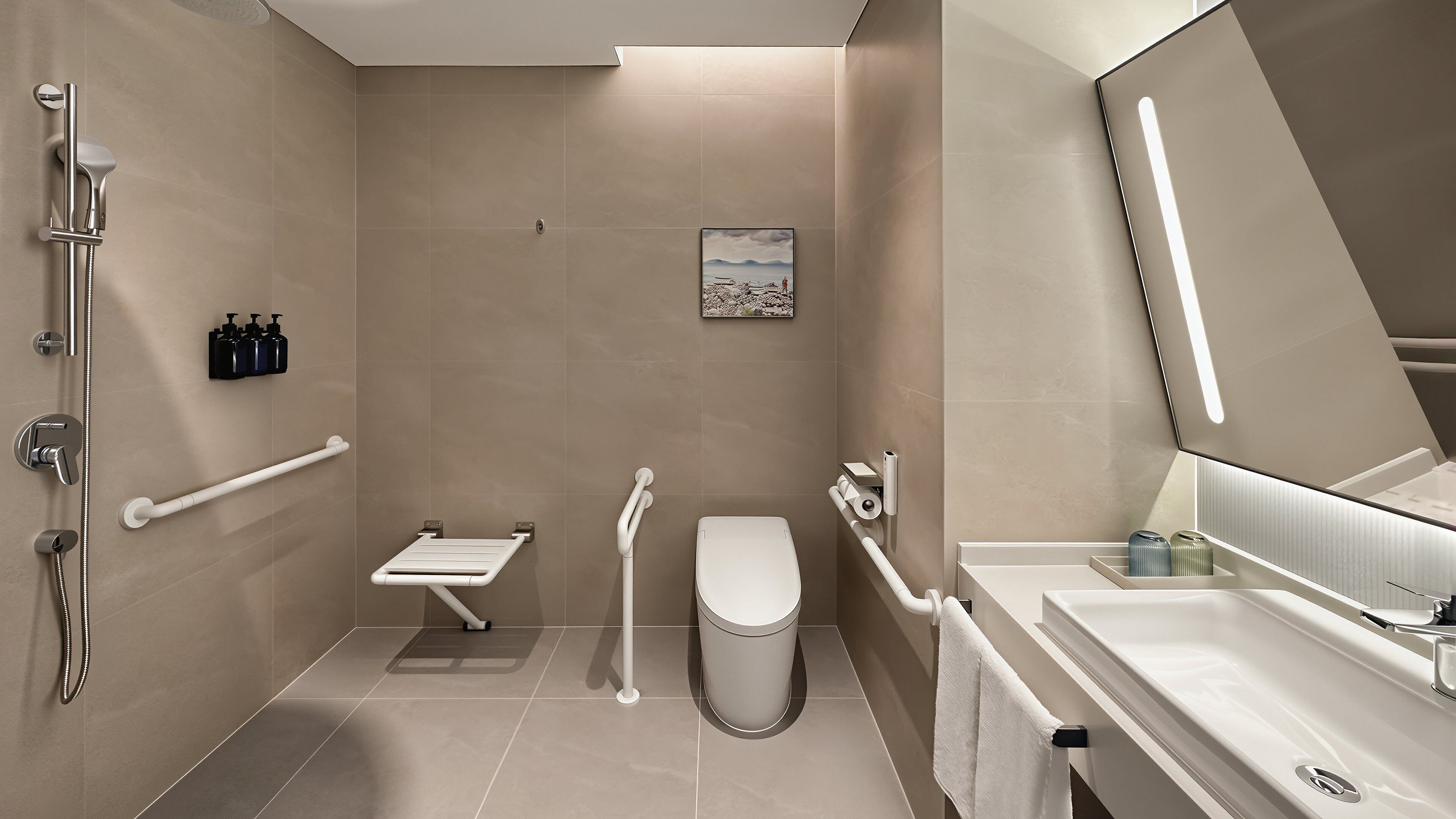 Un baño moderno con ducha, inodoro y lavamanos, equipado con barras de apoyo y un secador de manos.