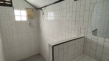 Basic Studio | Bathroom | Shower, towels, soap, toilet paper