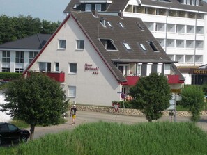 A building with a sloped roof, a sign reading 'Hotel Fritz,' and a visible entrance. - Holiday apartment in Büsum with swimming pool (Büsum)