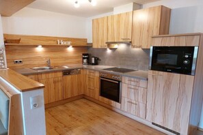 Fridge, oven, stovetop, dining tables