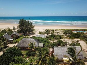 Comfort Chalet, Patio, Garden View | Beach | On the beach, white sand, beach bar - Bay View Lodge (Inhambane)