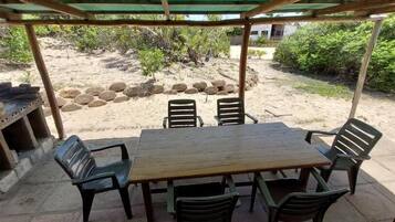 Deluxe Chalet, Patio, Beach View | Outdoor dining