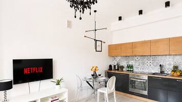Classic Apartment, Air conditioning | Living area | 43-inch Smart TV with satellite channels