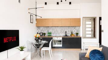 Classic Apartment, Air conditioning | Living area | 43-inch Smart TV with satellite channels