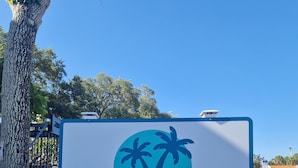 A motel sign with a palm tree logo and the text 'Motel Sunny Days.' - Nice renovated 1 bedroom Apartment Sunny Days Motel 3 (St. Petersburg)