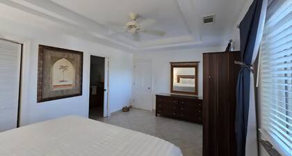 Spacious luxury suite in exclusive gated community steps from Grace Bay Beach.
