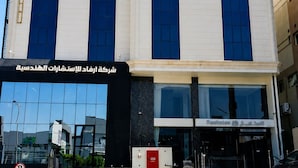 A hotel with a sign reading 'OPEN HOTEL' and a business sign below it.