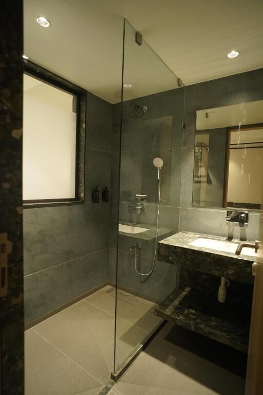 Shower, free toiletries, hair dryer, slippers