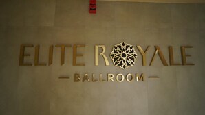 A sign for 'ELITE ROYALE BALLROOM' with a geometric design. - HOTEL SANKET ELITE (Malegaon)