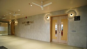A hotel entrance with a sign for 'ELITE ROYALE - BALLROOM' and a door marked '410-419'. - HOTEL SANKET ELITE (Malegaon)