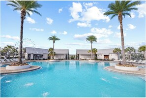 A swimming pool with palm trees, lounge chairs, and modern buildings. - 🦩Book Me Baby! Seaesta in Prominence🦩 (Inlet Beach)