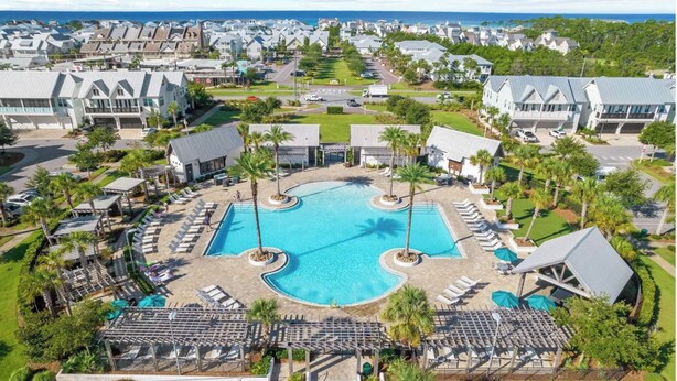 A resort with a central swimming pool, multiple lounge areas, and a view of the ocean. - 🦩Book Me Baby! Seaesta in Prominence🦩 (Inlet Beach)