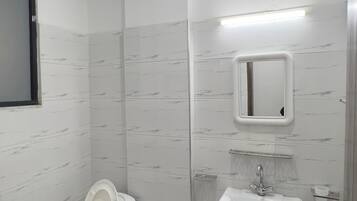Bidet, towels, soap, toilet paper