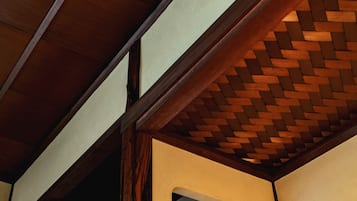 A wooden ceiling structure with a woven pattern.