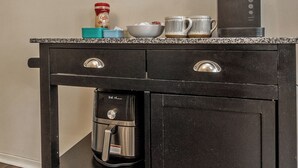 A kitchen with a coffee maker, a scale, and a clock on the wall. - Downtown Lehighton Just a 5 min drive to Jim Thorpe! (Lehighton)